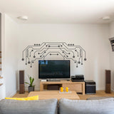 Modern TV wall decor featuring vinyl circuit board decals above a sleek television in a stylish living room.