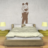 Police kissing wall sticker above a modern bed.