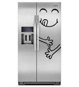 Funny happy face vinyl decal on a stainless steel refrigerator, adding a playful touch to kitchen decor.