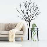Birch tree wall decal in a modern living room with cozy couch and decor.