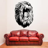 Large lion head wall decal above a red couch, adding a wild aesthetic to living room decor.