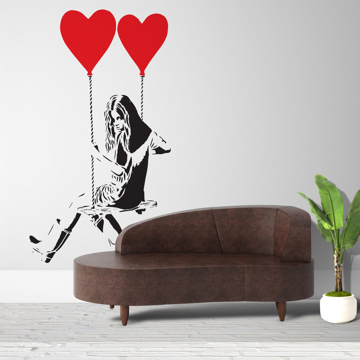 Girl with heart balloon wall sticker above a stylish couch.