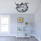 3D ceiling sticker featuring a blue sky and clouds design, creating a porthole effect in a stylish bedroom.