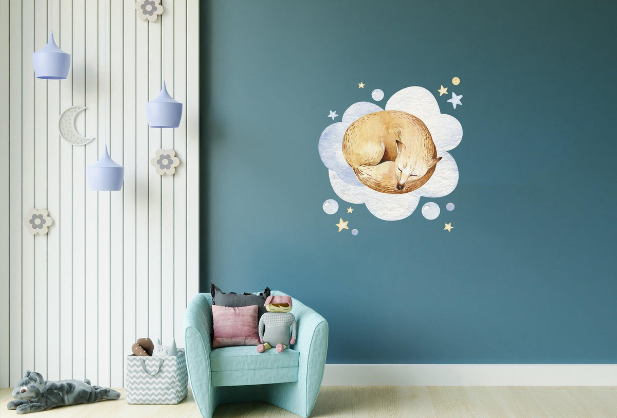 Dreamy baby nursery wall sticker featuring a sleeping fox on fluffy clouds.
