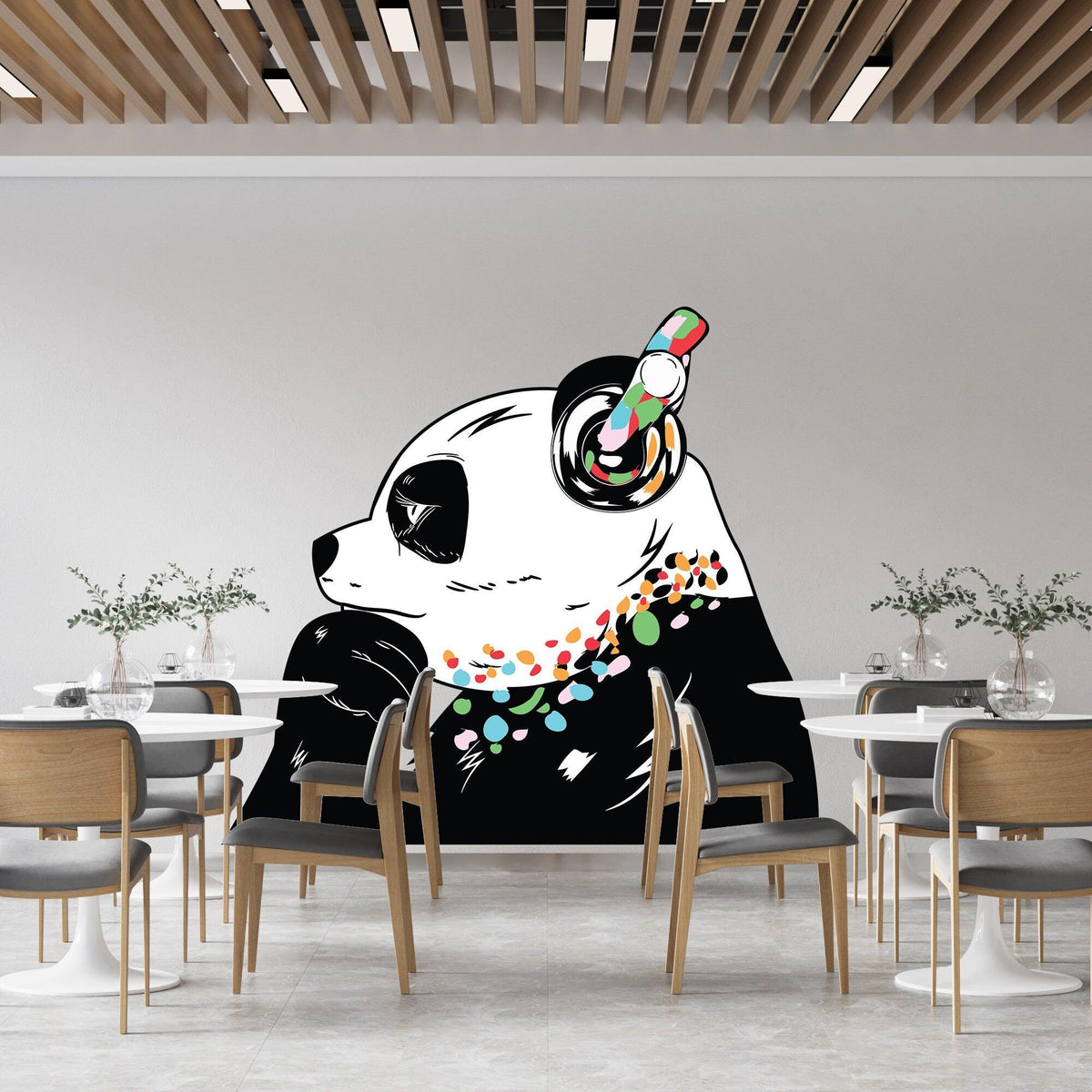 Panda in headphones wall decal displayed in a modern dining space.