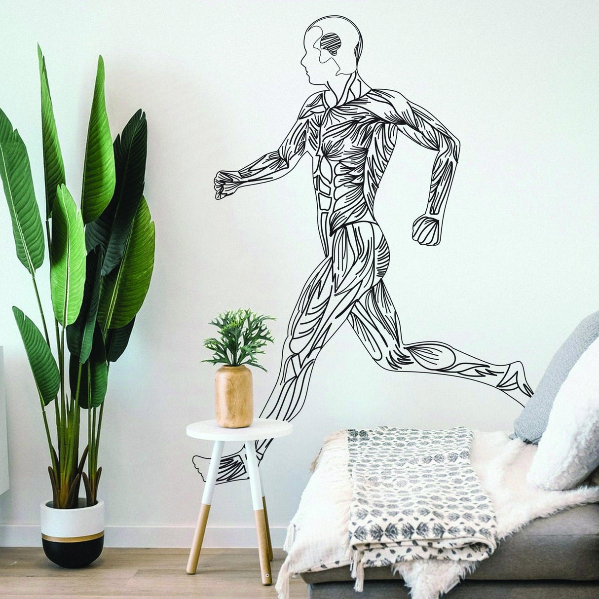 Mens body silhouette wall decal of a running figure.