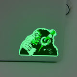 Glow in the dark monkey vinyl sticker on laptop.
