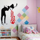 Black silhouette of Love Sick Girl wall decal with red hearts, adding urban art to a colorful bedroom decor.