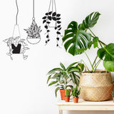 Botanical Oasis wall sticker featuring tropical hanging plant designs above real potted plants in a stylish room.