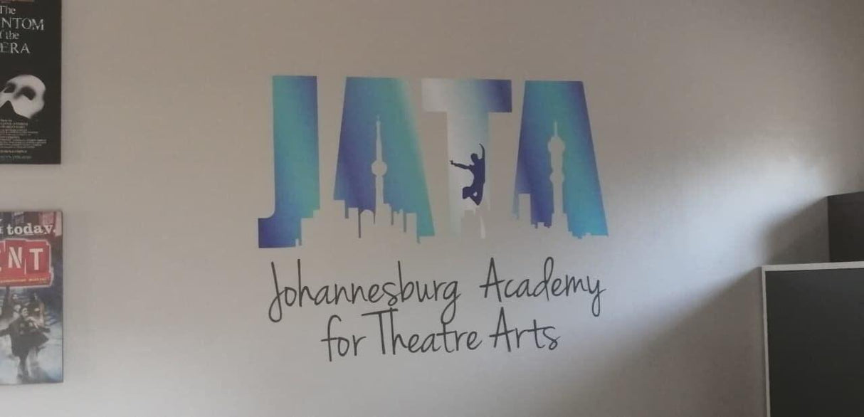 Custom theatre academy logo wall decal displayed in an interior.