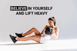 Motivational gym wall decal featuring the quote 'Believe in Yourself and Lift Heavy' with a woman exercising.