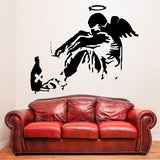 Fallen angel wall sticker above a red leather sofa.