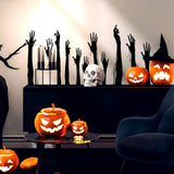 Hand silhouette vinyl decals displayed on a dark wall.