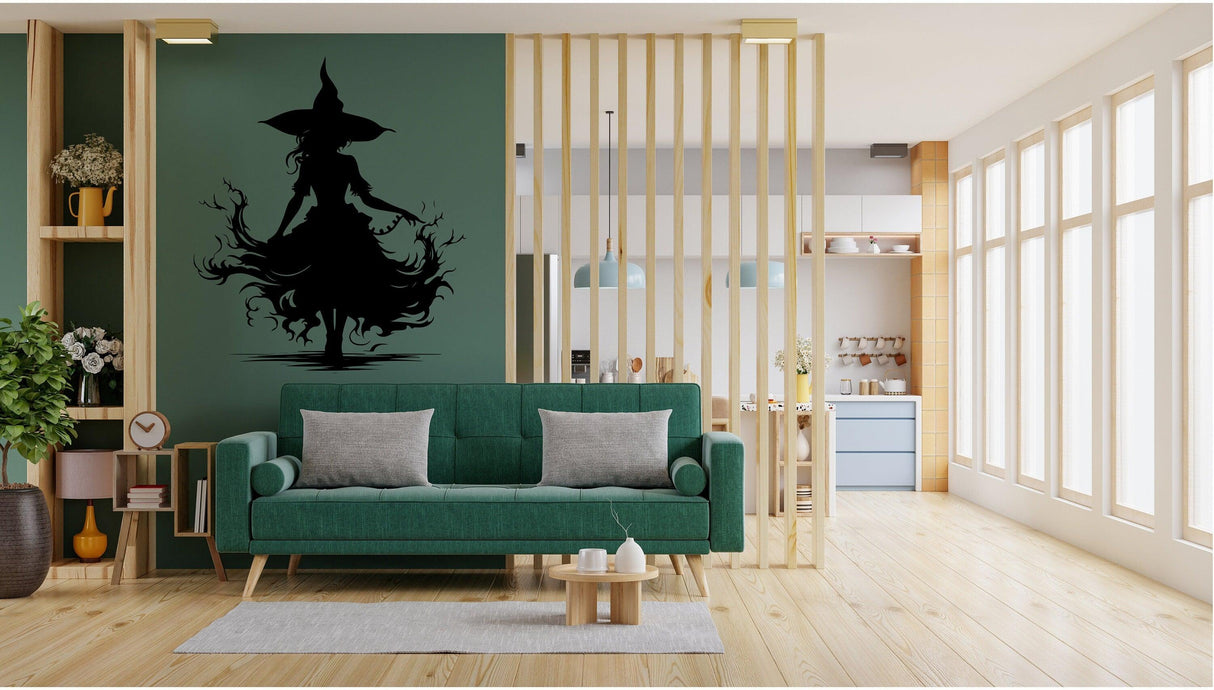 Halloween witch silhouette vinyl decal displayed on a green wall.