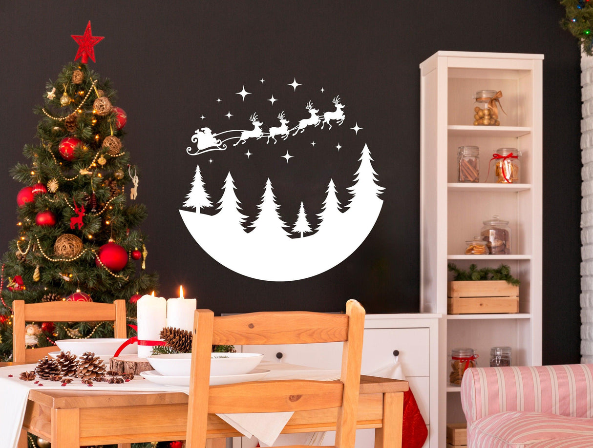 Circular Santa sleigh and deers wall decal on a festive dining room wall with Christmas tree.