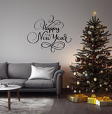 Elegant 'Happy New Year' wall vinyl sticker above a cozy sofa and Christmas tree with gifts.