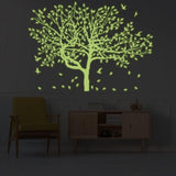 Glow-in-the-dark forest wall decal featuring luminous tree and leaves.